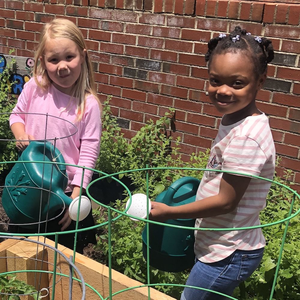  two girls gardening